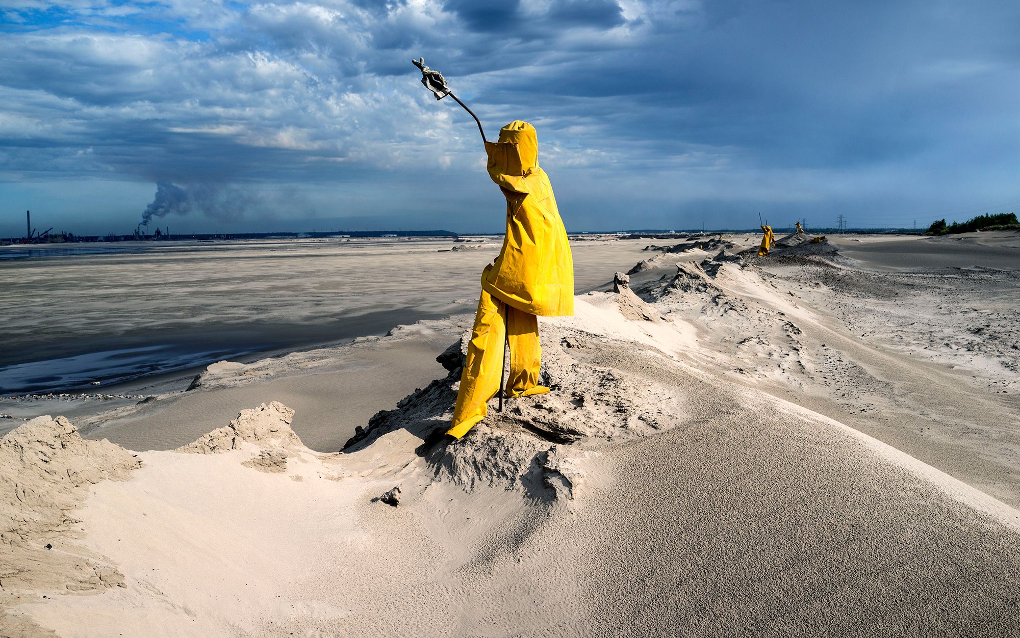 Scarecrows keep away migratory birds from the dangers of the tailing ponds created by the exploitation on the tar sands at Fort McMurray, Alberta, Can